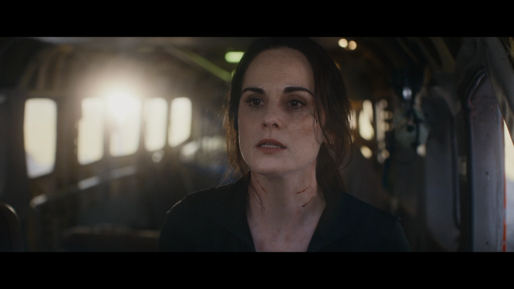 Madolyn (Michelle Dockery) lit by the on-camera flare in the final film